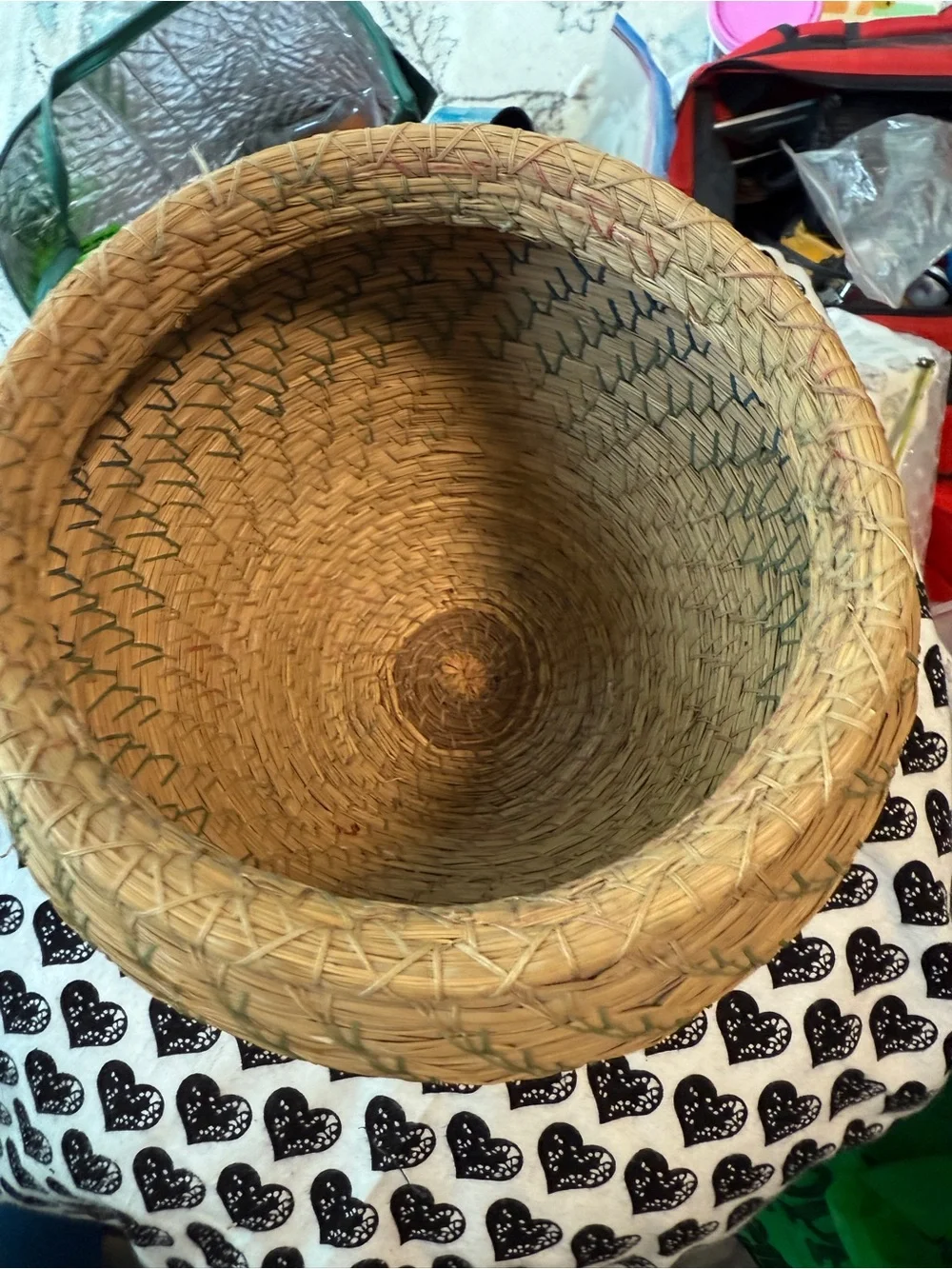 vintage Native American style pine needle basket, similar to those identified